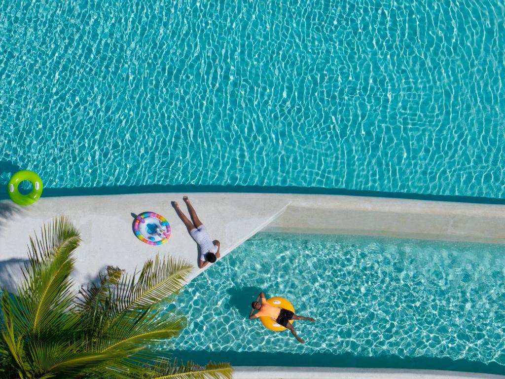 MALDIVES SUNSET OVERWATER POOL VILLA — FOR THE WHOLE FAMILY! 7 NIGHTS • 2 ADULTS + 2 KIDS • ALL-INCLUSIVE MAY 2027 FROM £6,999 PER FAMILY